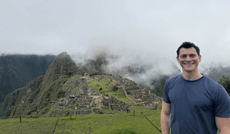 Nomadic Matt posing for a photo near Machu Picchu in Peru