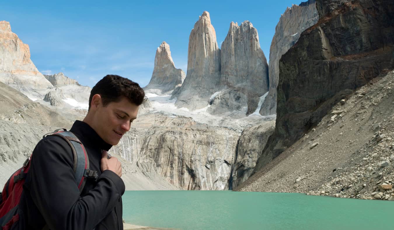 Nomadic Matt posing for a photo while hiking Patagonia in South America